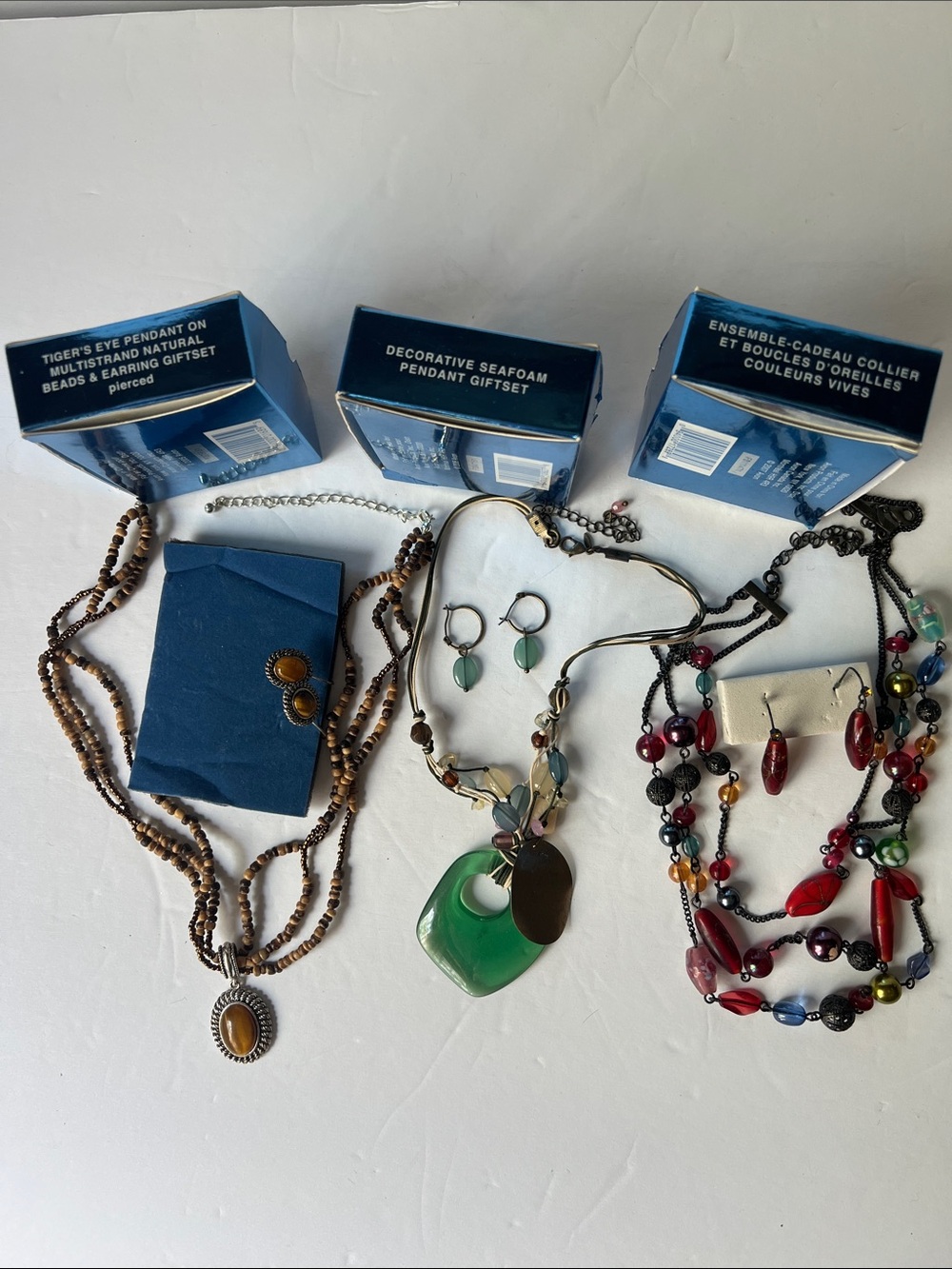 Assorted Avon  Women's Beaded Necklaces and Earrings - Green, Brown, Red .